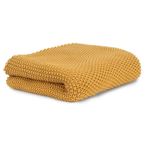 
                  
                    Knitted blanket in organic cotton
                  
                